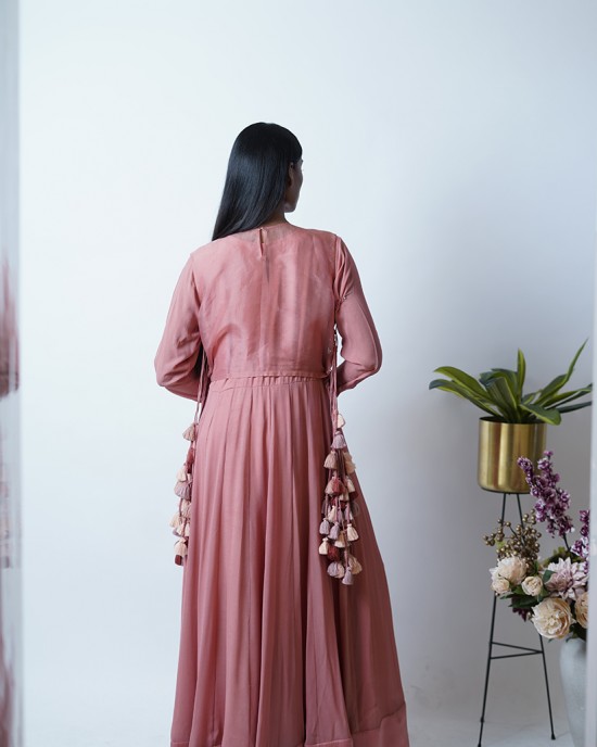 Rose Pink Anarkali with churidar sleeves, paired with a short jacket and heavy tassels on either side (SDH1012) Rose Pink Anarkali with churidar sleeves, paired with a short jacket and heavy tassels on either side (SDH1012)